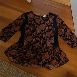 Peplum top with slimming side panels